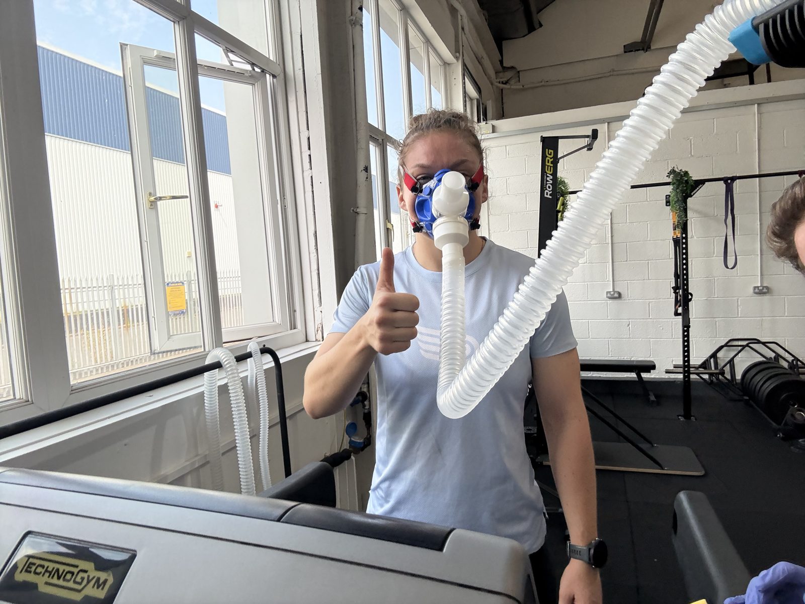 Runner giving a thumbs up while wearing the VO2 mask before a step test