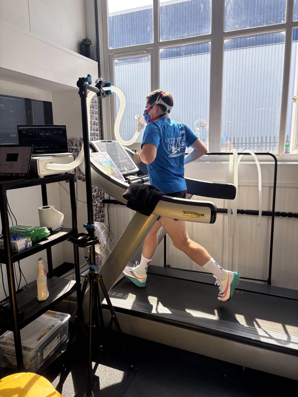 Runner on the treadmill mid-step-test wearing a VO2 mask at the Box Nutrition lab