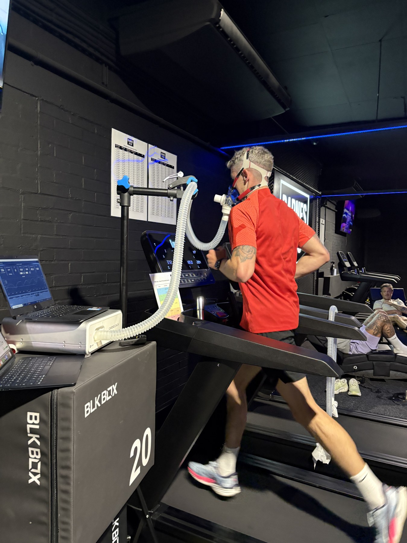Athlete undergoing VO2max treadmill testing at the Box Nutrition & Performance lab, breath-by-breath mask connected to the metabolic cart